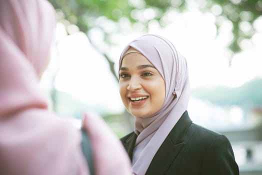 Beautiful Muslim business woman talking and smile.