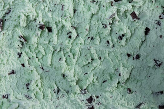 Top view of mint flavour ice cream with chocolate flakes in box
