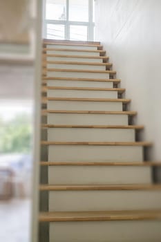 Wooden and white metal staircase, stock photo