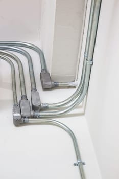 Steel electric conduit pipes of ceiling, stock photo
