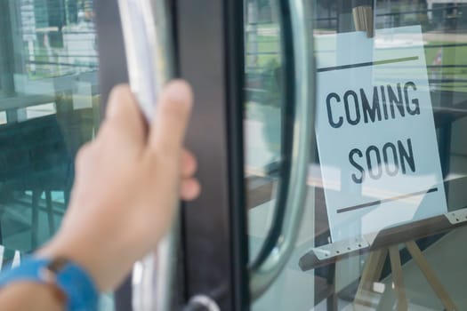 Woman hand opening see through door, stock photo