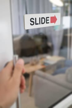 Woman hand opening see through door, stock photo