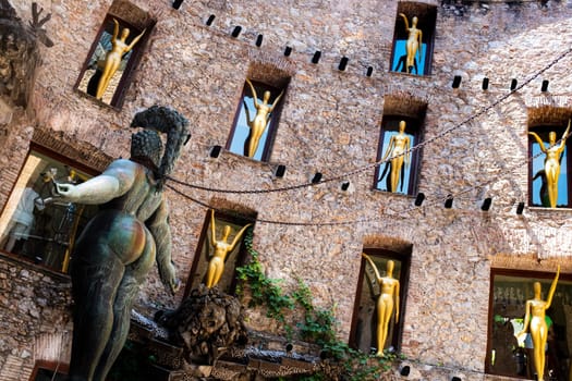 The surrealistic Museum of Salvador Dalì, details from main courtyard: a statue of a shapely woman with chains standing in the stage of the theater.