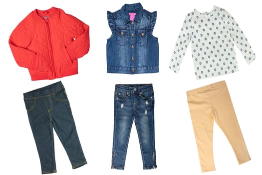 Collage set of little girl spring clothes isolated on a white background. The collection of a jeans vest and two denim pants, a red down jacket, a shirt and a yellow trousers. Little girl autumn fashion.