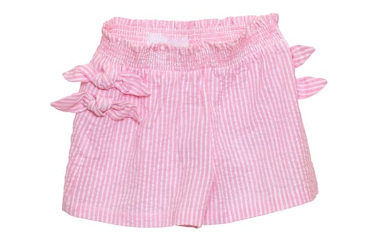 Summer shorts isolated. Closeup of a stylish fashionable striped pink shorts with ribbon bow isolated on a white background. Little girl fashion. Macro.