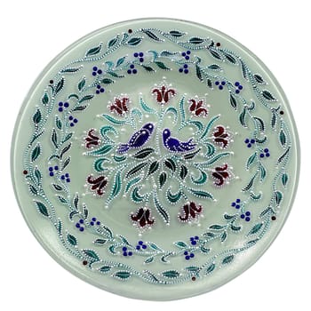 Set of decorative ceramic dishes hand-painted with acrylic paints floral pattern isolated on white background.
