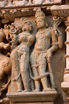 Stone sculpture of divine couple at Parshwanath Jain Temple in Khajuraho, Madhya Pradesh, India, Asia