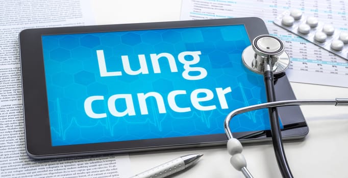 The word Lung cancer on the display of a tablet