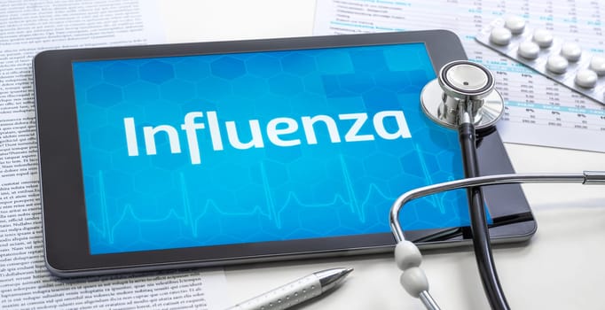 The word Influenza on the display of a tablet