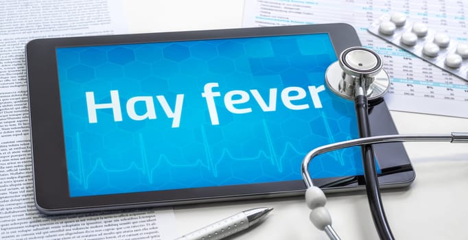 The word Hay fever on the display of a tablet