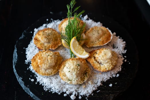 deep fried Hokkaido Scallops Shell with crusty bread serve with lemon and salt.