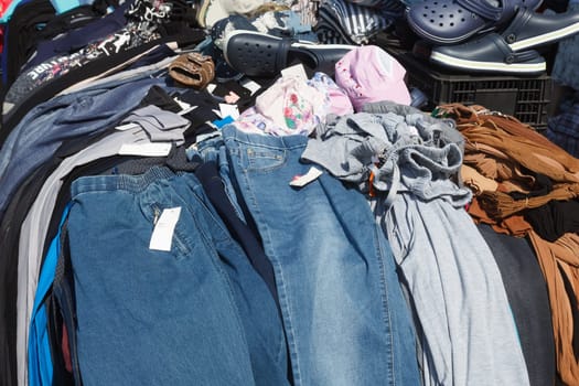 Pile of clothes. Closedup of clothes on sale in a flea market.