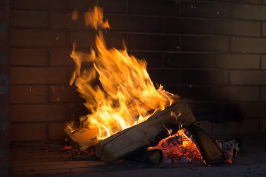 Close up shot of burning firewood in the fireplace.