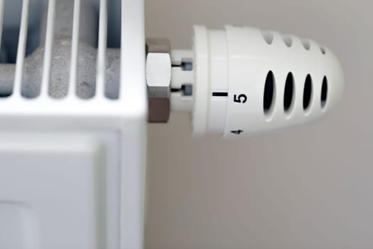 Heating radiator with temperature regulator close-up