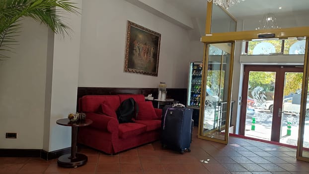 October 15 2024 Prague Czech Republic Europe Lobby red sofa hotel apartment wooden indoor house interior design . High quality photo
