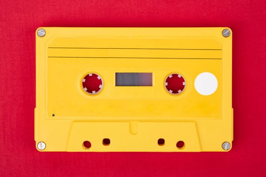 Retro Audio Tape isolated on red background
