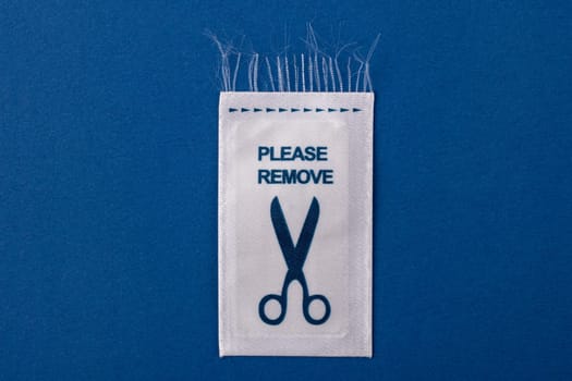 Laundry Label with scissor on bluebackground
