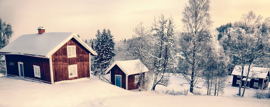 old red cottages, farms in a snowy wintery landscapoe, 17th century in Sweden, panoramic view