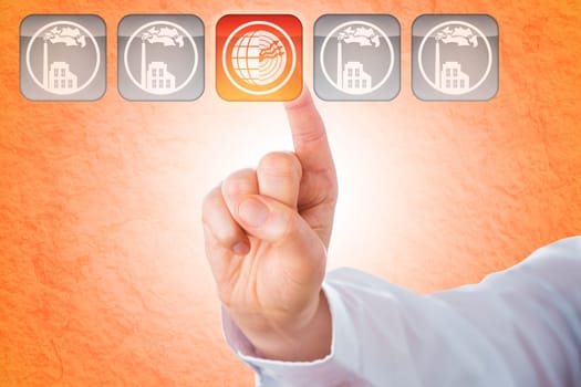 Close-up of an index finger highlighting a transparent push key showing a geothermal energy icon. Four grey keys with factory symbols remain grey. Background with texture of earth and subsurface soil.
