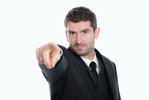 businessman in suit is pointing in to the camera