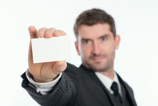 businessman in dark suit showing his visiting card