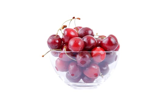 cherries on glass cup isolated on white background