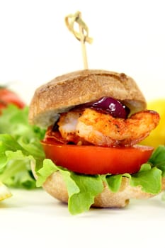 Shrimp burger with tomato,red onion and salad