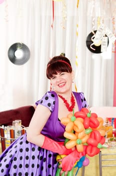 Happy brunette in retro style with bouquet of balloons