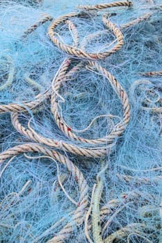 Background made from blue fishing nets and ropes