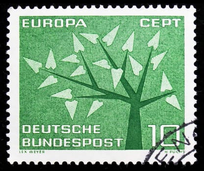 MOSCOW, RUSSIA - AUGUST 8, 2019: Postage stamp printed in Germany, Federal Republic, shows Stylized tree with 19 leaves, Europa (C.E.P.T.) 1962 - Tree serie, circa 1962