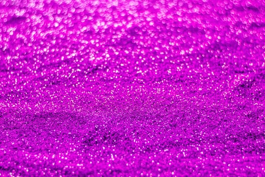 Glitter light abstract purple bokeh christmas light blurred background