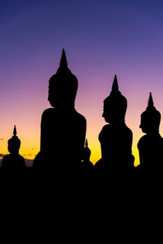 Silhouette big buddha stature with color of sky twilight dark filter style, Public in thailand, Nakhon si thammarat province