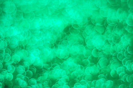 Abstract green light bokeh christmas light blurred background