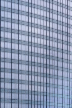 Urban abstract - window facade of business center office building with reflections and colours. Philadelphia PA USA