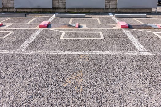 Empty parking lot in outdoor parking area with automatic locking system