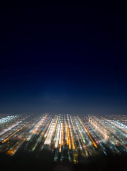 Abstract long exposure, experimental surreal photo, city and vehicle lights at night.