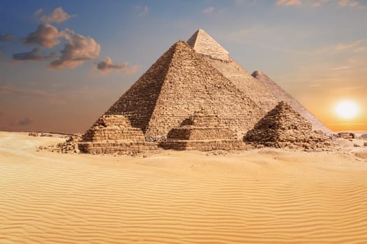 Famous Pyramids of Giza, beautiful sunset photo.