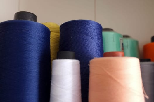 Colorful yarn on spool, yarn on tube, cotton, wool, linen thread