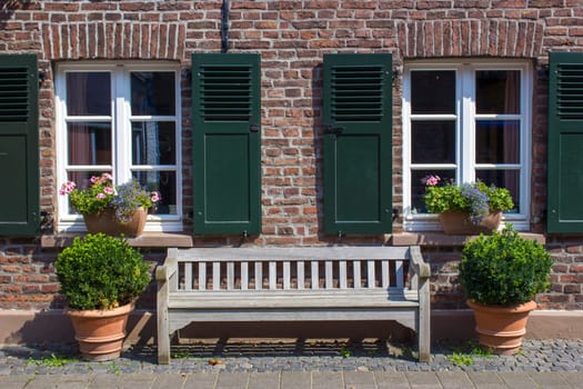 Old German house with windows with wooden shutters, Wachtendonk, North-Rhine Westphalia, Germany
