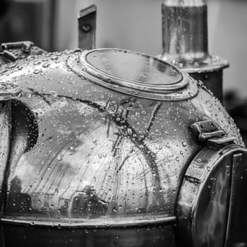 Reflection of a mast in an old ship compass, closeup. Black and white photo