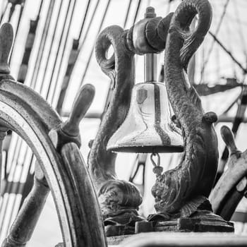 Ship's Bell and wheel the old sailboat, close-up