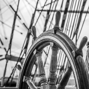 Ship's Bell and wheel the old sailboat, close-up