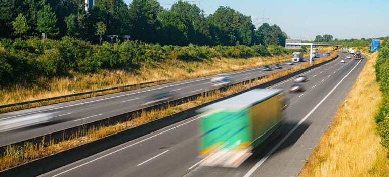 Lots of Trucks and cars on a Highway - transportation concept