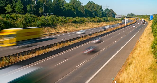 Lots of Trucks and cars on a Highway - transportation concept