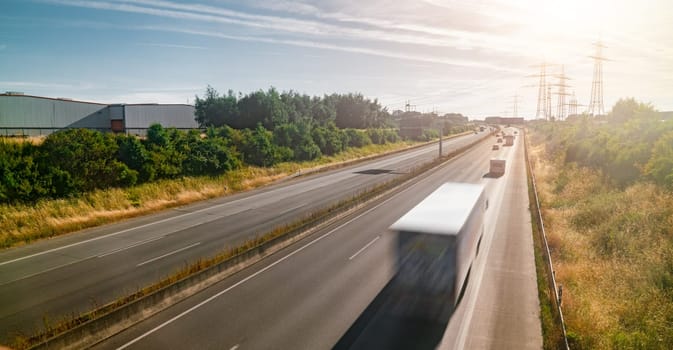 Lots of Trucks and cars on a Highway - transportation concept
