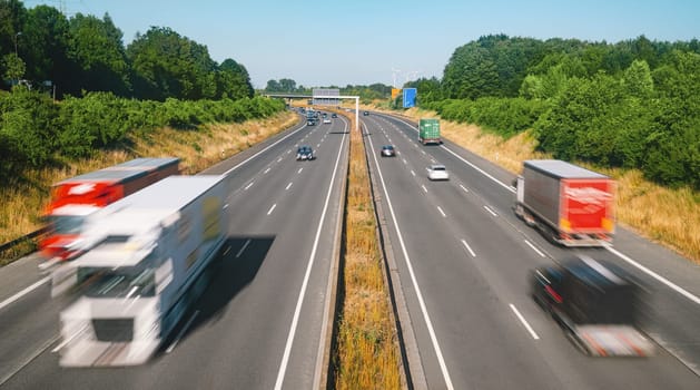 Lots of Trucks and cars on a Highway - transportation concept
