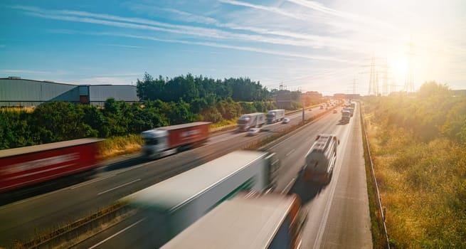 Lots of Trucks and cars on a Highway - transportation concept