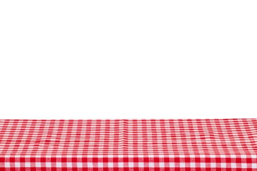 Empty table background. Empty wooden deck table covered with red white checkered tablecloth isolated on a white background. Space for your food and product display montage.