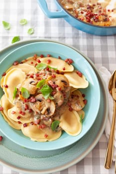 Italian tortelli pasta with a creamy mushroom sauce