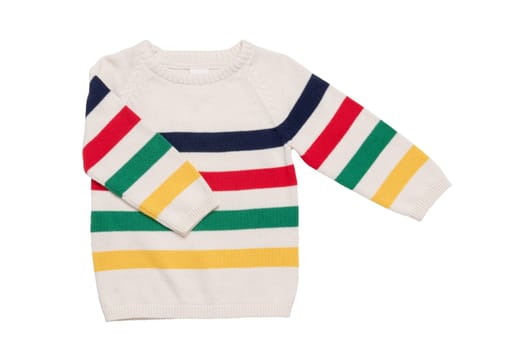 Autumn and winter children clothes. Close-up of colorful striped cozy warm sweater or pullover isolated on a white background. Kids autumn fashion.